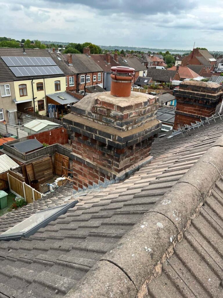 This is a photo taken from a roof which is being repaired by Tuxford Roofing Repairs, it shows a street of houses, and their roofs